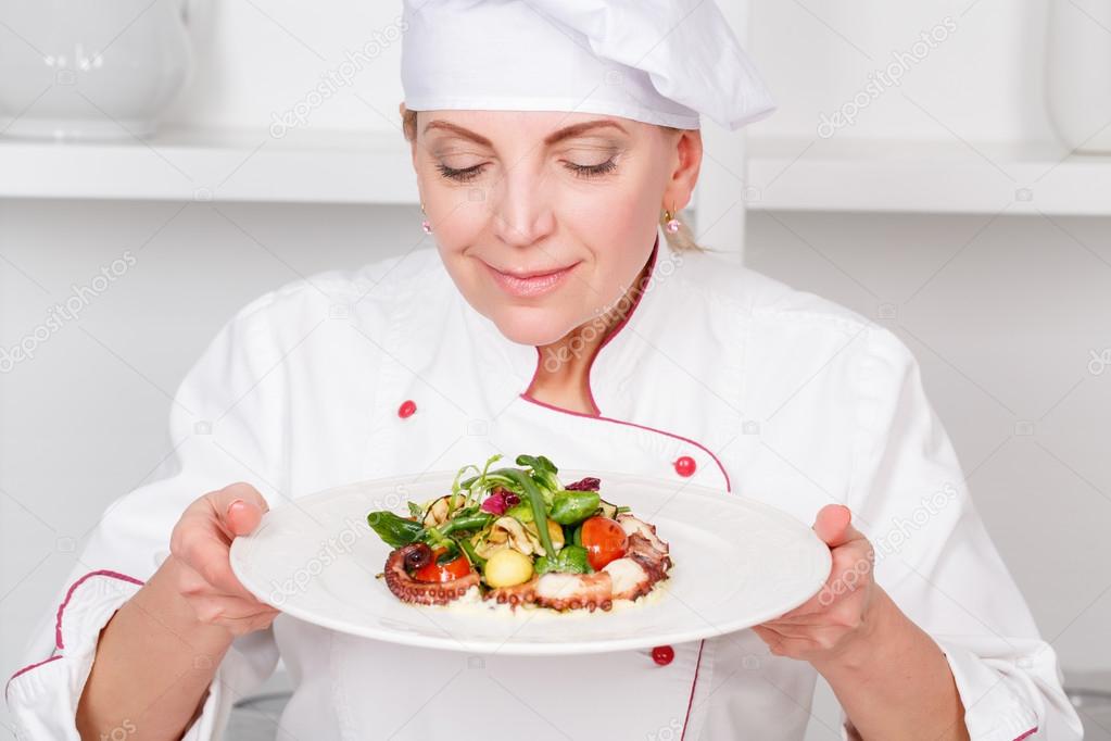 Chef-cook smelling   octopus salad