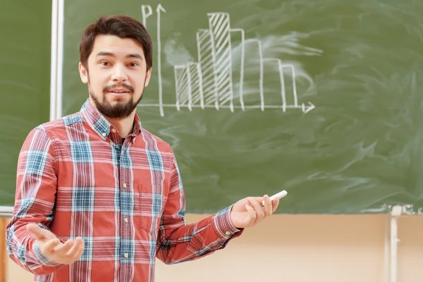 Students put graphs on a blackboard — Stock Photo, Image