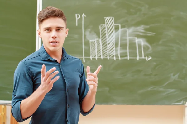 Students put graphs on a blackboard — Stock Photo, Image