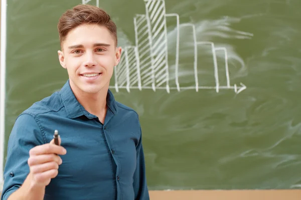 Students put graphs on a blackboard — Stock Photo, Image