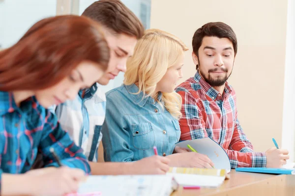 Students work with test-book — Stock Photo, Image