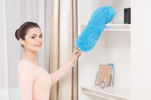 Beautiful woman working with cleaning sweep — Stock Photo, Image