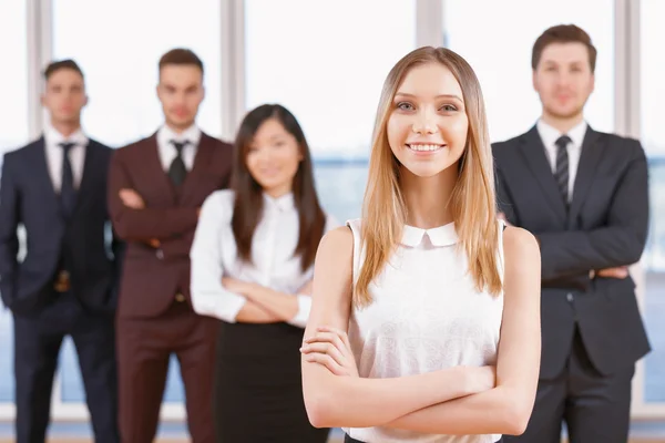 One of businesswoman or businessman standing in the foreground a — Stock Photo, Image