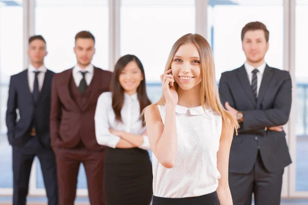 One of businesswoman or businessman standing in the foreground a — Stock Photo, Image