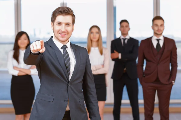 One of businesswoman or businessman standing in the foreground a — Stock Photo, Image