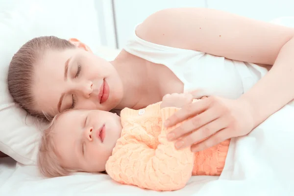 Sleeping baby and his mother — Stock Photo, Image