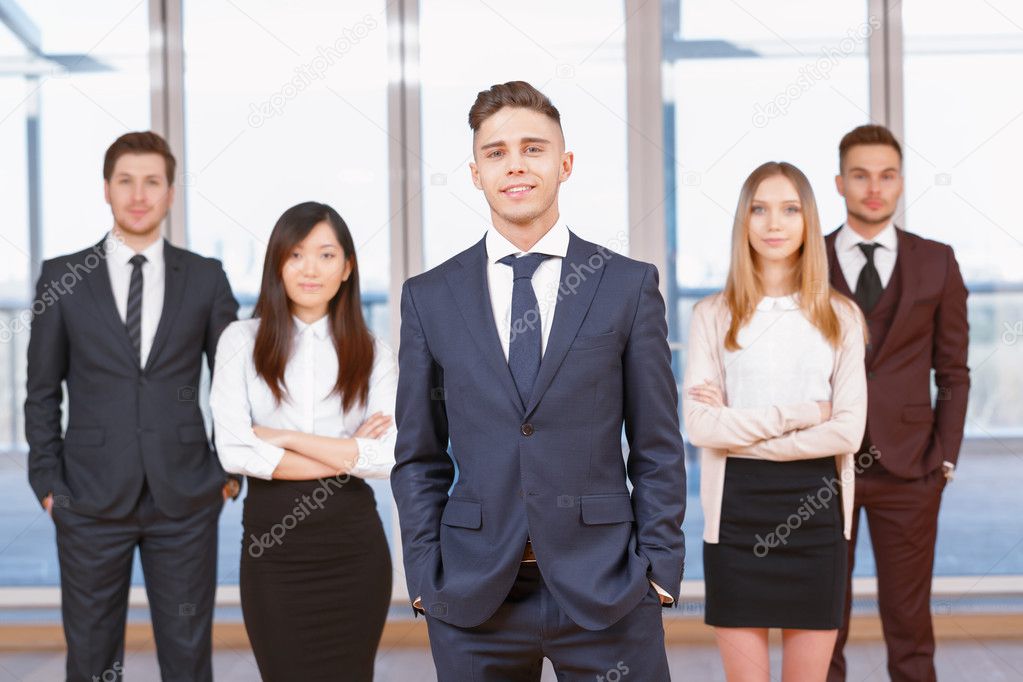 One of businesswoman or businessman standing in the foreground a