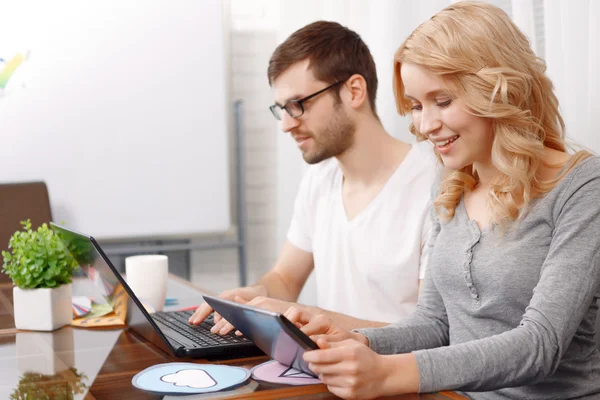 Portrait of a young developer and his female colleague — Stock Photo, Image