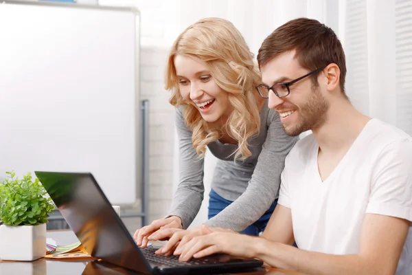Portrait of a young developer and his female colleague — Stock Photo, Image