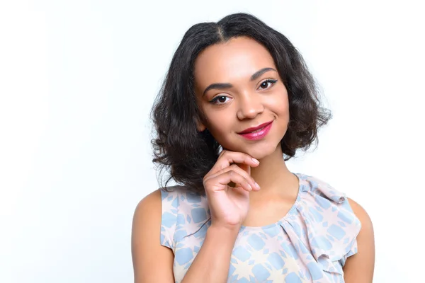 Mulatto girl touching her chin with fingers — Stock Photo, Image