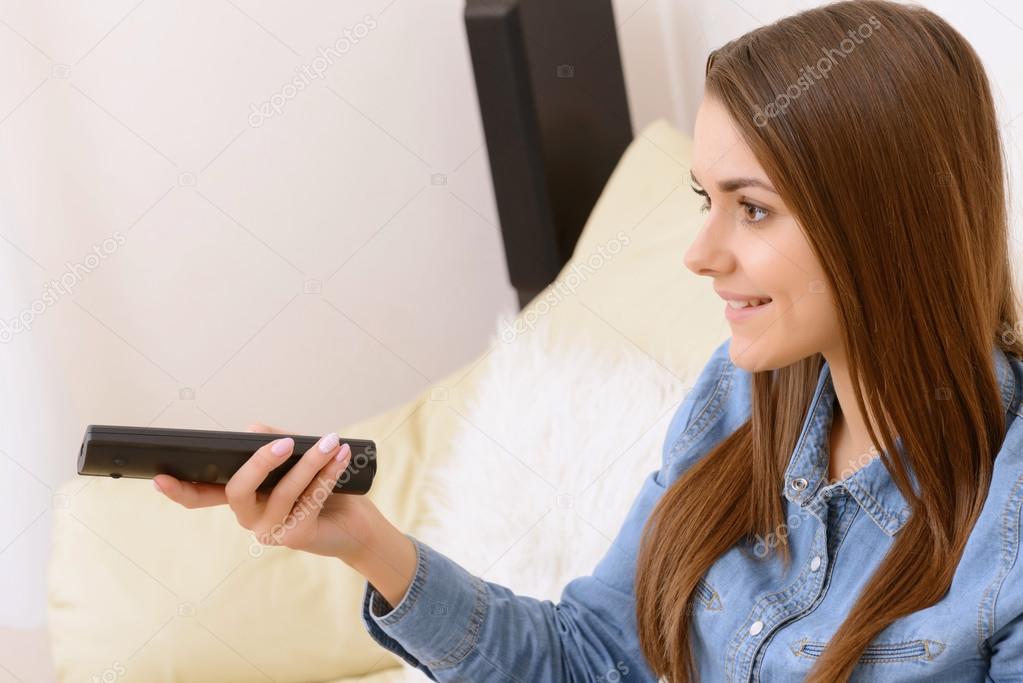 Girl watching  comedy and smiling