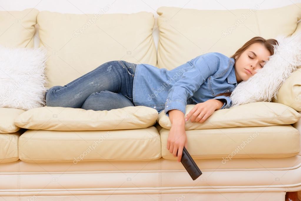 Girl sleeping in front of TV 