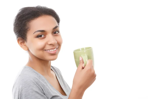 Beautiful young woman standing with cup — Stock Photo, Image