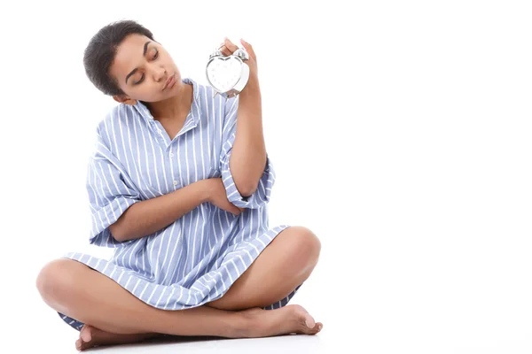 Pretty young mulatto girl holding alarm clock — Stock Photo, Image