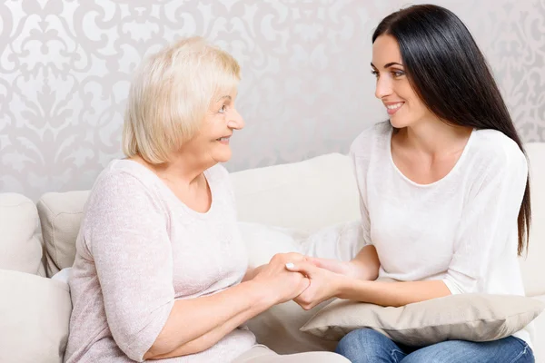 Granny and granddaughter holding hands — Stock Photo, Image