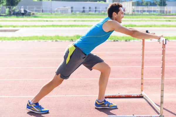 Young man doing sport exercises — Stock Photo, Image