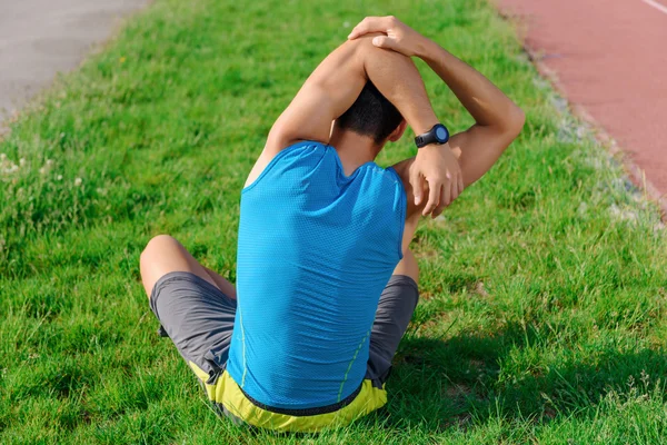 Back view of man stretching his arms — Stock Photo, Image