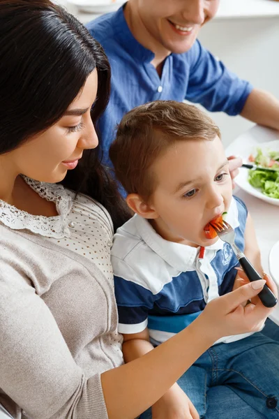 Young mother feeding her child — Stock Photo, Image