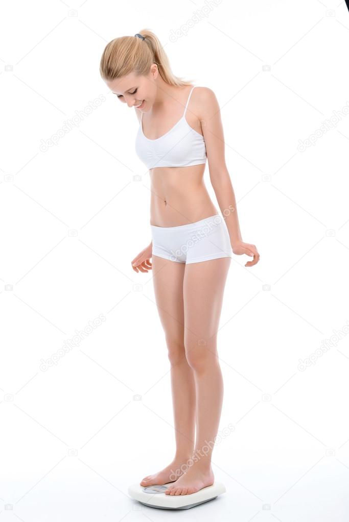 Young fit blond girl isolated on white
