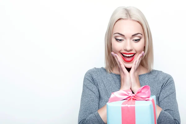 Amazed blond-haired woman getting present — Stock Photo, Image