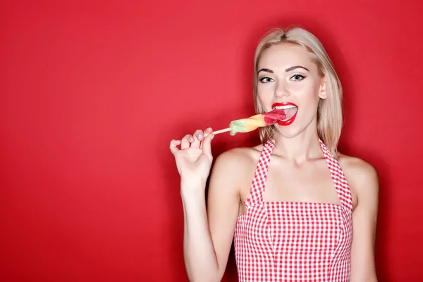 Smiling woman posing with candy — Stock Photo, Image