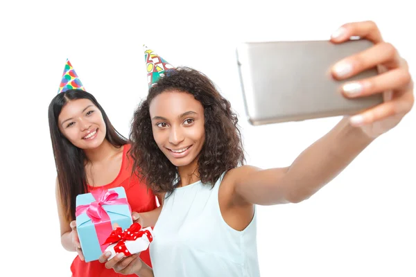 Cheerful girls holding birthday presents — Stock Photo, Image