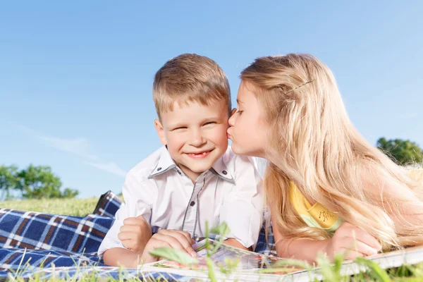 Cute little children sitting on the blanket — Stock Fotó