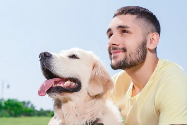 Handsome guy with his dog — Stok fotoğraf
