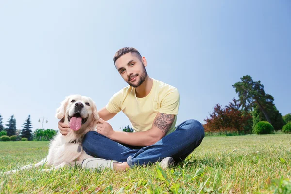 Handsome guy with his dog — Stock Fotó