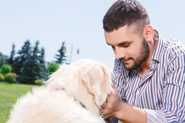 Golden retriever with his owner — Stok fotoğraf