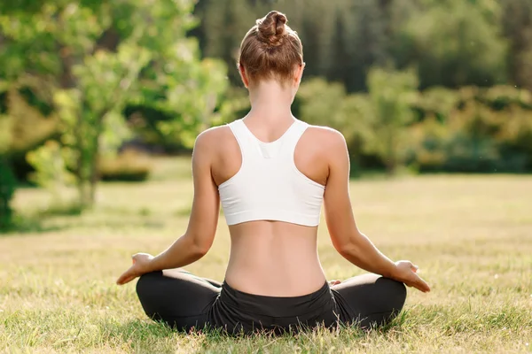 Pleasant young woman practicing yoga — Zdjęcie stockowe