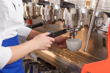 Close-up of barista making coffee