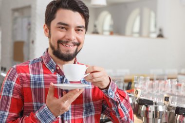 Portrait of smiling man with coffee