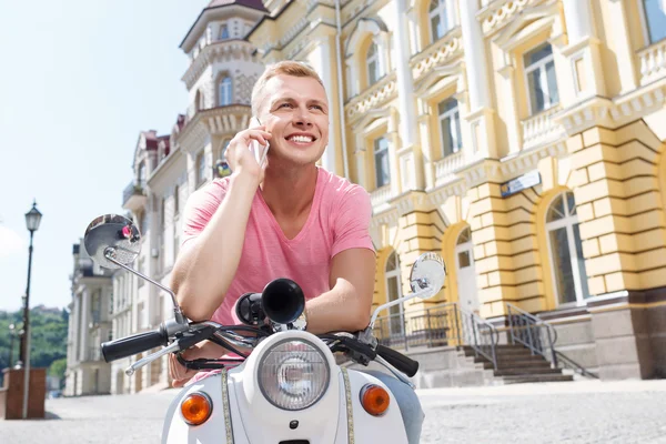 Handsome man doing selfie on scooter — Stockfoto