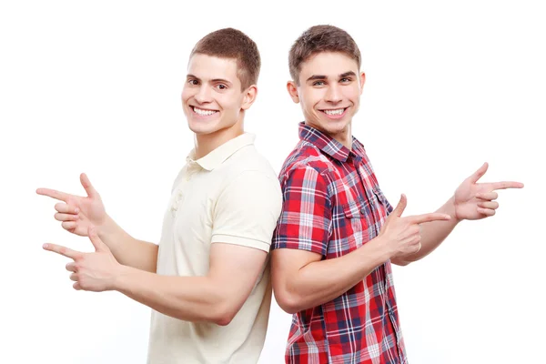 Two handsome men posing on isolated background — Stockfoto