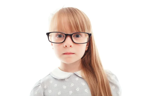 Pleasant little girl wearing glasses — Stock Photo, Image