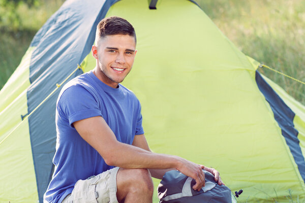 Young tourist in the field 