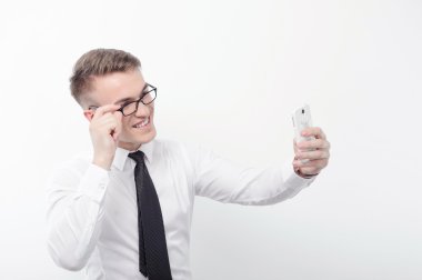 Businessman in glasses doing selfie