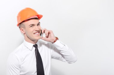 Foreman'ın cep telefonu konuşurken gülümseyen