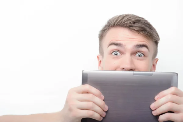 Man covering his face with tablet — Stok fotoğraf