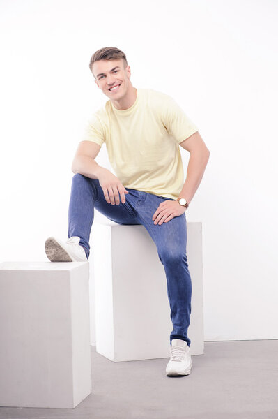 Young handsome man posing on isolated background 