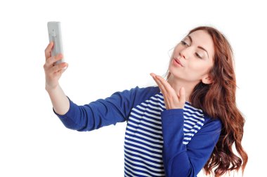 girl sending kisses while making selfie