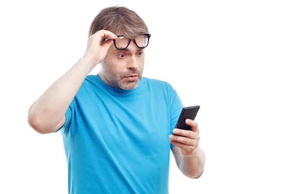 Handsome man holding mobile phone — Stock Photo, Image