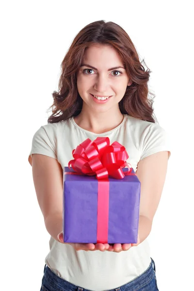 Smiling nice girl holding present — Stock Photo, Image