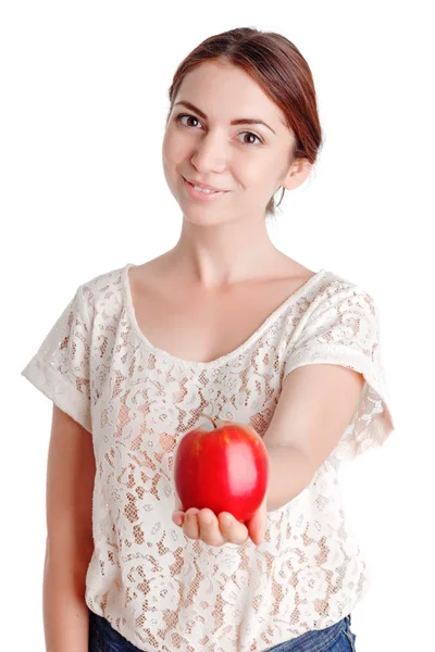 Young  girl giving  apple — Zdjęcie stockowe