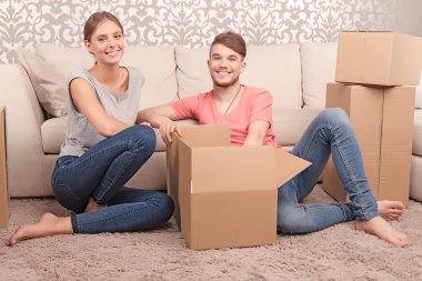 Nice couple opening boxes 