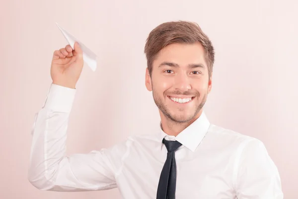 Pleasant lawyer holding paper plane — Stock Photo, Image