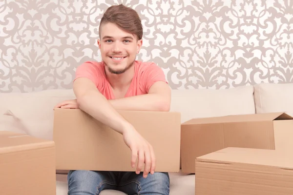 Pleased young husband holding box — Stock Photo, Image