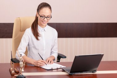 Beautiful secretary working on computer 