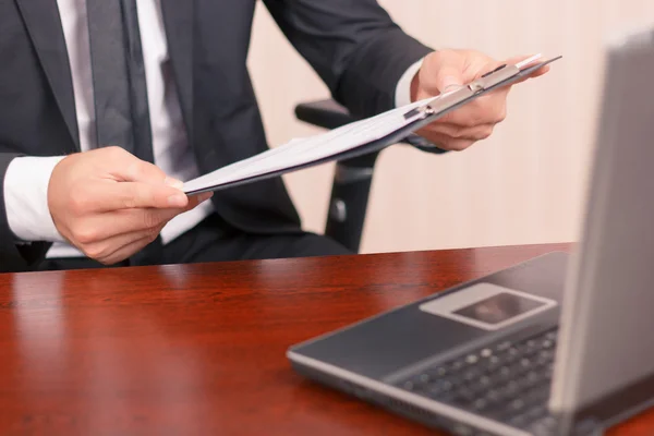 Nice lawyer holding papers — Stockfoto